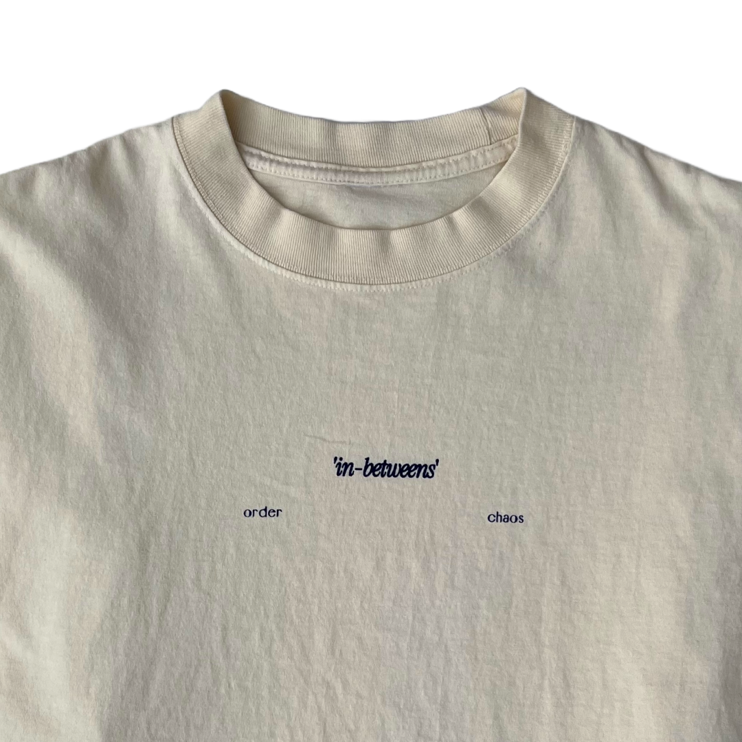 ORDER 'IN-BETWEENS' CHAOS CRÉME TEE